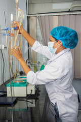 surgeon with surgical instruments