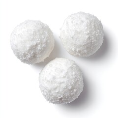 Three round, white, snow-covered confectionery treats arranged in a triangle against a white background
