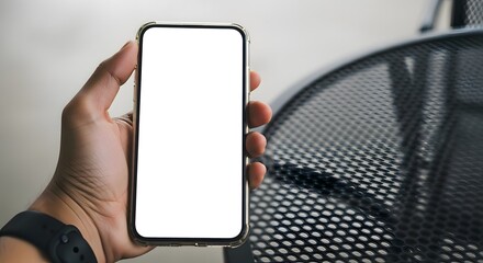 Hand holding smartphone mockup with blank white screen for app ui design and product promotion use