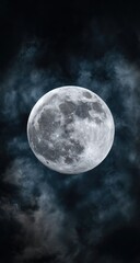 Full moon behind dark, stormy clouds