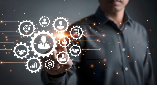 Man touching a digital interface with gears and business icons floating in the foreground space - Powered by Adobe