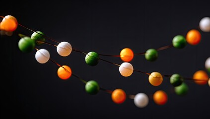 Colorful, spherical string lights on dark background