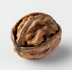 Close-up of a whole walnut, shell cracked open, revealing the nut inside.  A single, light brown nut with a slightly rough texture is visible. The shell is a darker, somewhat mottled brown