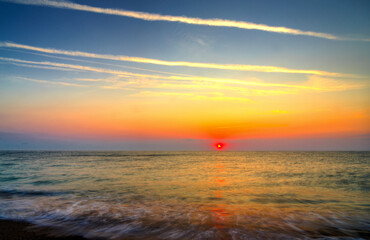 Beautiful summer sunrise over the beach