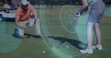 Golf instructor kneeling marking line and launching digital overlay guiding student putting stroke - Powered by Adobe