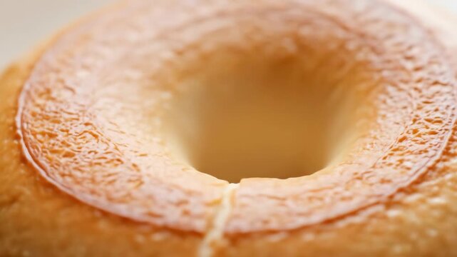 Close-up of golden brown fresh bagel with hole, food, baked, breakfast, healthy.