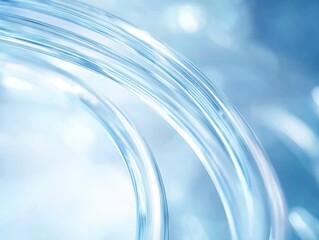 Abstract close-up of translucent, curved glass-like structures with soft blue lighting and a blurred background