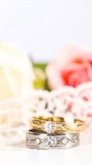 Two wedding rings, diamonds, roses