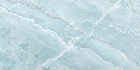 Obraz premium A detailed close-up of a polished light blue marble or onyx stone surface with intricate white and grey veining.