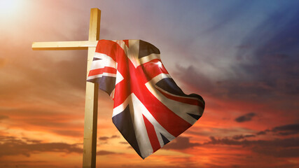 The British national flag on a religious cross against the sky. A concept for UK holidays.  