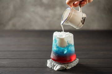 Cherry blue dirty soda in glass. Trending summer drink