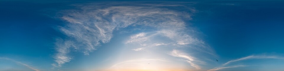 360 panorama of glowing sunset sky with bright Cirrus clouds. HDR 360 seamless spherical panorama. Full zenith or sky dome sky replacement for aerial drone panoramas. Climate and weather change. © panophotograph