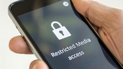 Restricted media access on smartphone screen highlights social media ban concerns