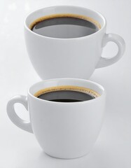 Two white coffee cups filled with dark coffee
