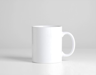 Obraz premium Blank white ceramic mug mockup, perfect for coffee, tea, or product branding on a simple, white background.