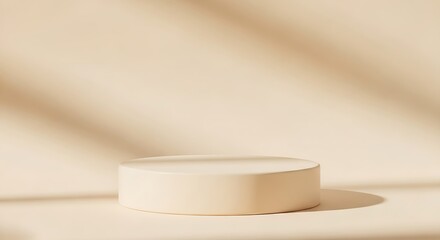 A cream-colored, cylindrical display podium sits on a soft, beige backdrop, illuminated by natural light, casting gentle shadows.