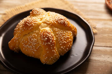 Pan de Muerto. Typical Mexican sweet bread with sesame seeds, that is consumed in the season of the day of the dead. It is a main element in the altars and offerings in the festivity.
