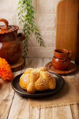 Pan de Muerto. Typical Mexican sweet bread with sesame seeds, that is consumed in the season of the day of the dead. It is a main element in the altars and offerings in the festivity.