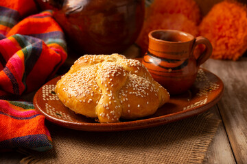 Pan de Muerto. Typical Mexican sweet bread with sesame seeds, that is consumed in the season of the day of the dead. It is a main element in the altars and offerings in the festivity.