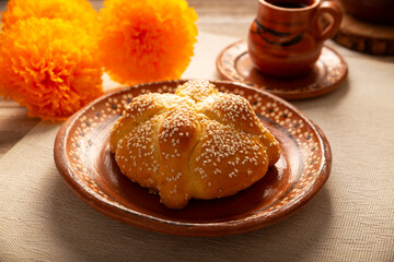 Pan de Muerto. Typical Mexican sweet bread with sesame seeds, that is consumed in the season of the day of the dead. It is a main element in the altars and offerings in the festivity.