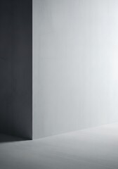 A minimalist interior scene, featuring a stark contrast between dark and light gray walls, showcasing a simple, geometric composition.