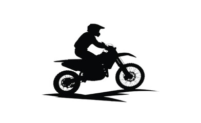 Obraz premium Motocross Rider Silhouette Leaning into a Turn on a Dirt Bike