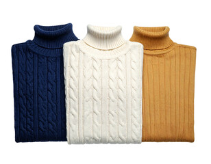 Three folded cable knit turtleneck sweaters in navy, cream, and beige