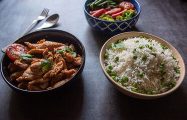 Full meal rice chicken and vegetables.