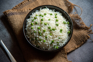 Matar pulao or basmati rice prepared with peas served in a bowl. Close up, selective focus.