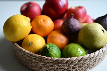 Vibrant mix of pomegranate, figs, apples, and citrus fruits. Perfect illustration for cookbooks, recipe sections, and editorial content about nutrition and healthy eating.