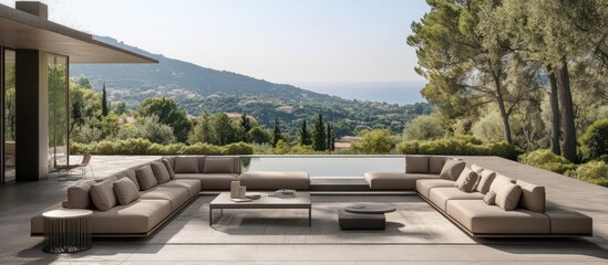 Outdoor sectional sofa set by pool with mountain view