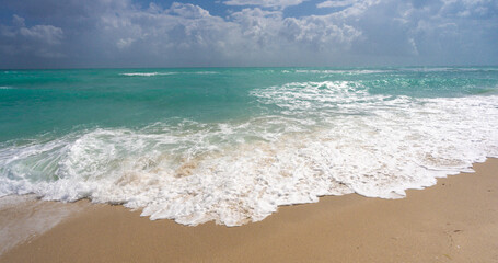 Sea wave. Blue ocean waves. Foamy wave. Rolling sea beach waves. Gentle sea beach wave. Summer sea beach.