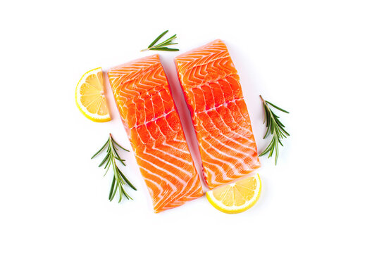Fresh salmon fillet, spices and lemon slices on white background