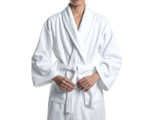 A person wearing a white bathrobe.  The robe is a simple, classic style with a V-neck, belted waist and long sleeves. The hands are holding the belt