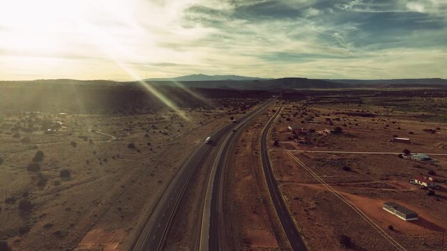 Aerial drone view of desert highway and mountains in New Mexico, USA