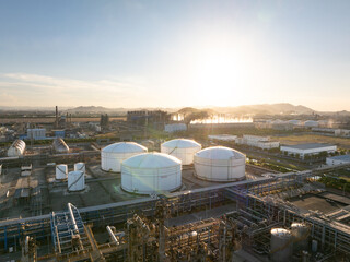 Aerial views of industrial areas with numerous large storage tanks