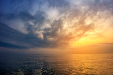 Sunset over the sea. Beautiful seascape. Dramatic sky.