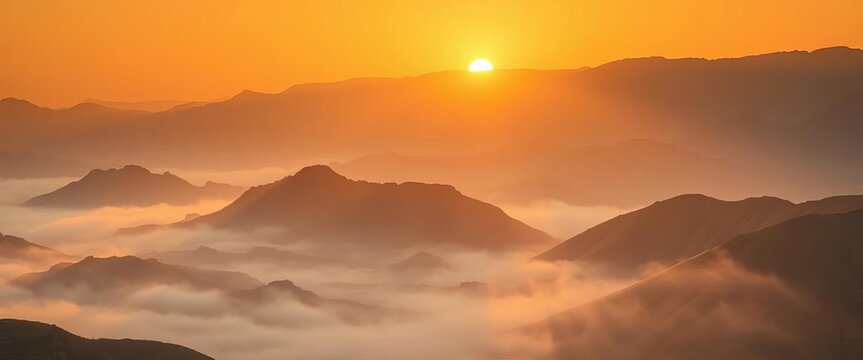Golden sunrise paints the Asir Mountains, mist clinging to valleys ,  aerial view,  nature