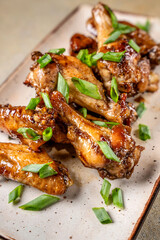 Glazed chicken wings with green onion