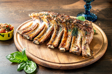 Grilled lamb ribs on wooden board