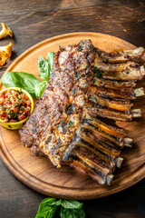 Rack of grilled lamb ribs with herbs