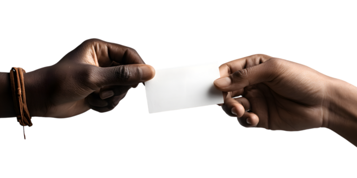 Two hands exchanging a blank white business card against a dark background