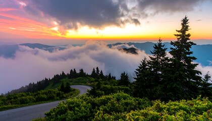 Sunset over misty mountain road