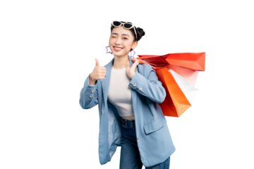 portrait Asian Woman giving a thumbs up with shopping bags. She is wearing sunglasses on top of her head and carrying shopping bags on her shoulders on PNG