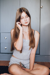 Fototapeta premium Portrait of a beautiful girl with green eyes, the girl has long hair