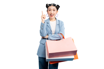 portrait Asian Woman joyfully pointing while holding shopping bags. She's wearing sunglasses on PNG