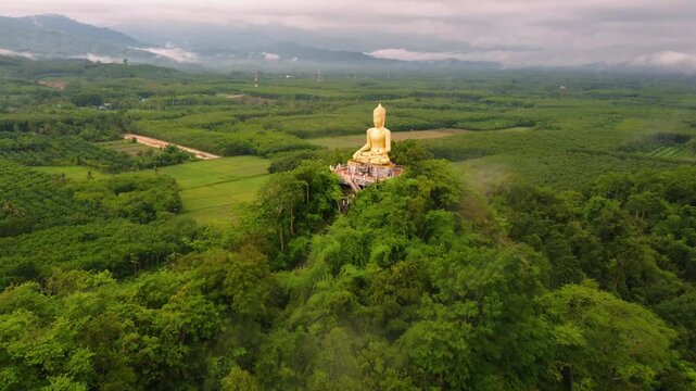 &ldquo;Phra Phuttha Sihingkhiri Sritat Buddha &ndash; Golden Statue on Khao Phra Mountain, Phipun, Thailand&rdquo;