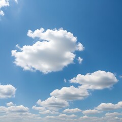 A vast expanse of cerulean blue sky dotted with fluffy, white cumulus clouds creates a serene and tranquil scene.