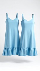 Two identical light blue sleeveless dresses with ruffled hems, shown against a white background.  They feature a simple V-neck and adjustable straps