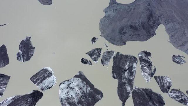  Aerial slow motion view of melting glacier and floating icebergs as result of Atlantic ocean meridian overturning circulation Gulf stream collapse